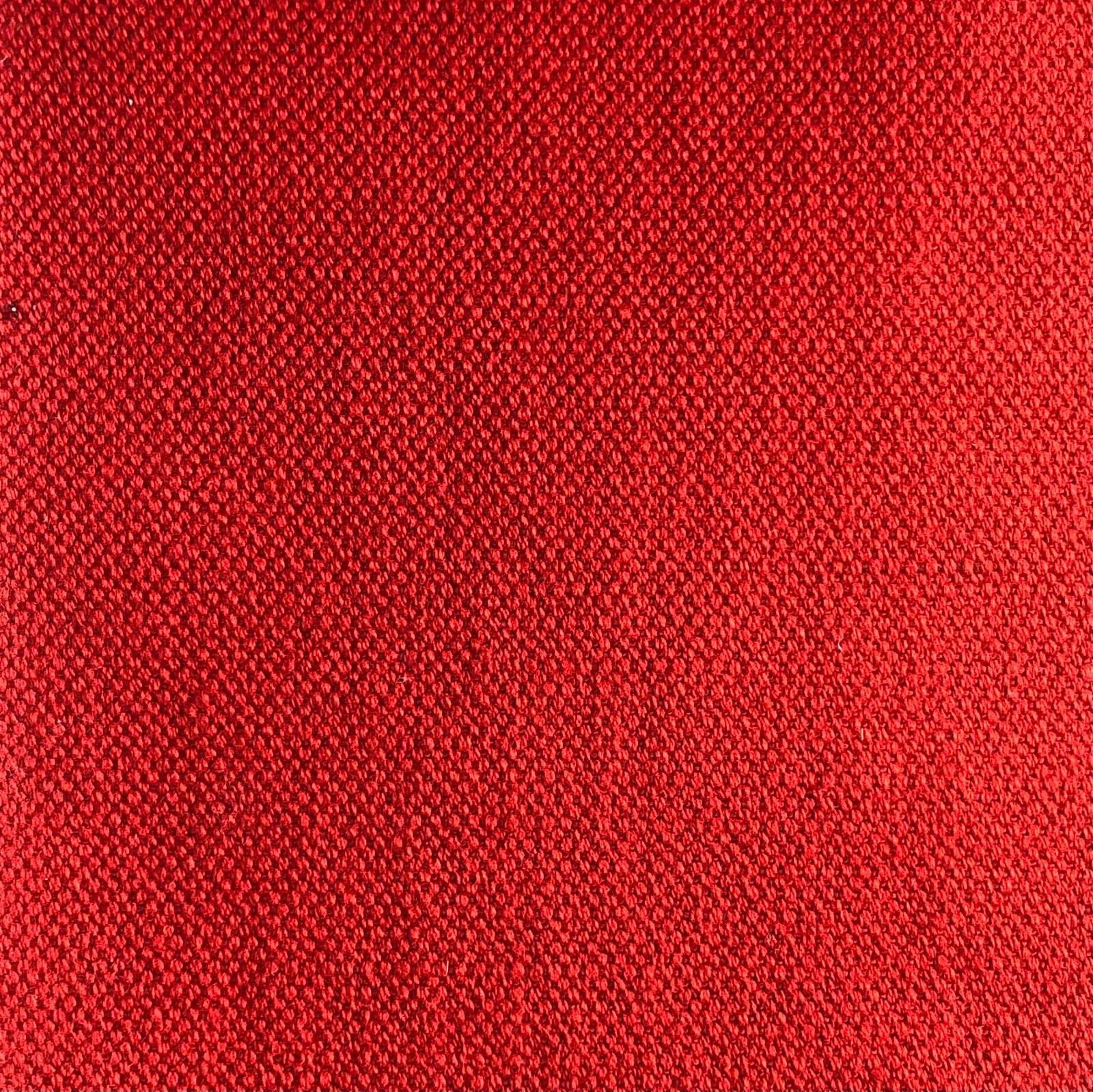 Close-up of vivid scarlet red Duo 122 fabric with a fine textured weave
