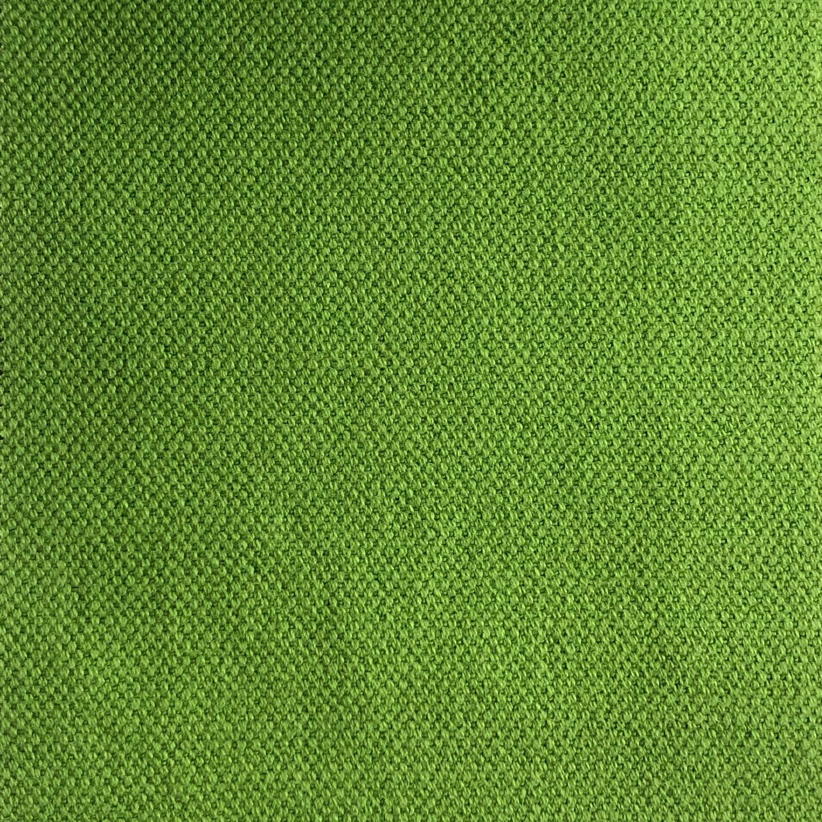 Close-up of fresh grass-green Duo 133 fabric with a fine textured weave