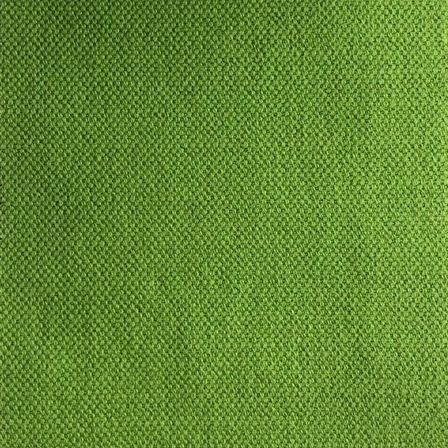 Close-up of fresh grass-green Duo 133 fabric with a fine textured weave