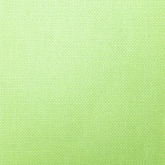 Fresh lime-green textile showing a tiny, tightly woven geometric texture