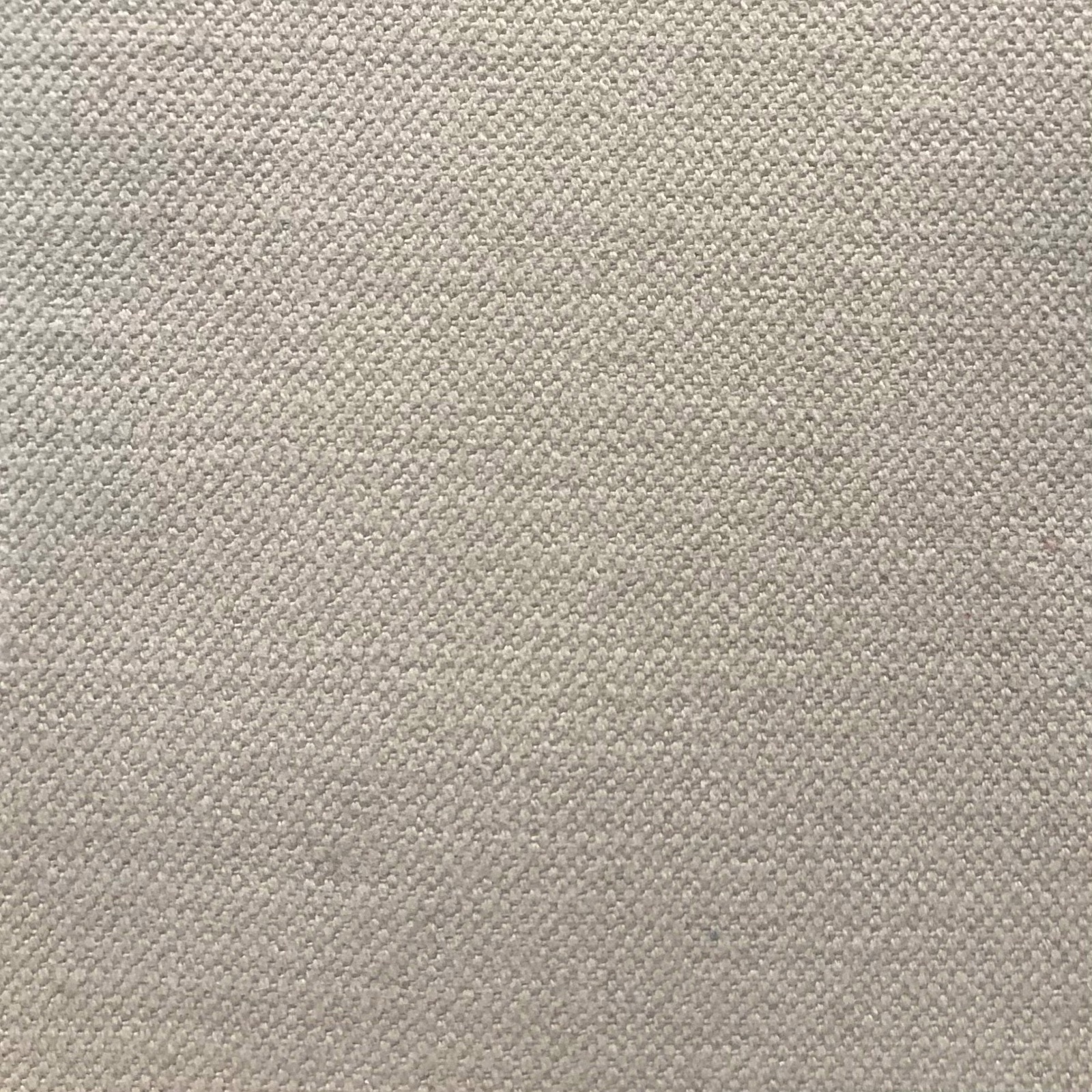 Close-up of pale taupe-grey fabric with a fine, softly mottled woven texture