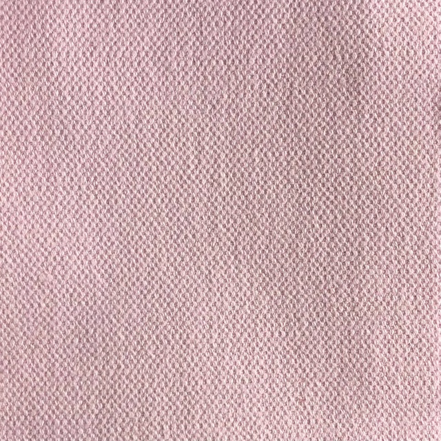 Dusty blush-pink woven swatch with a fine flecked, softly textured surface