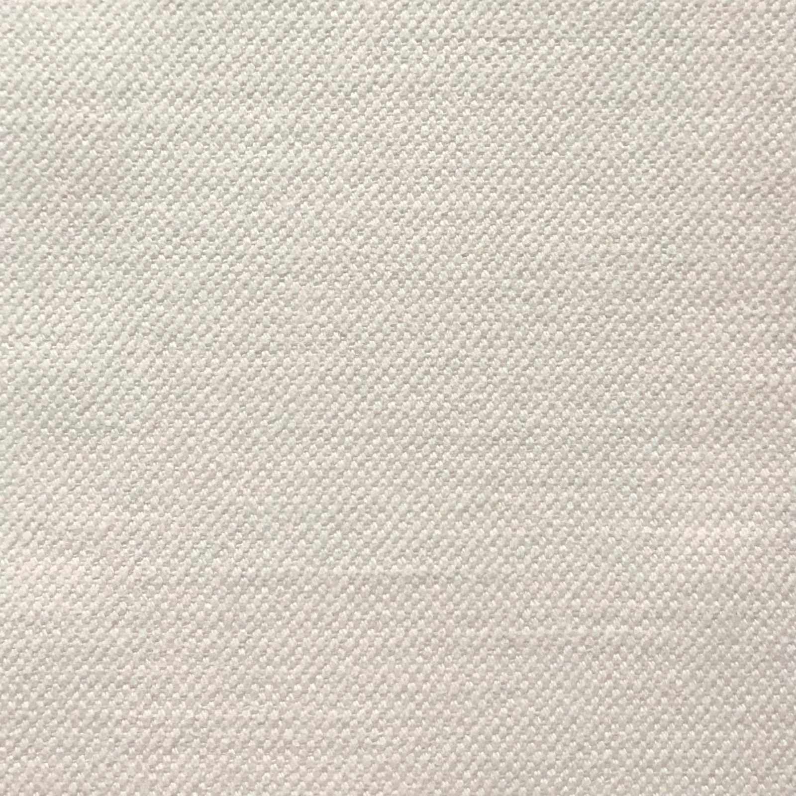Close-up of pale oat-beige fabric with a fine, tightly woven textured surface