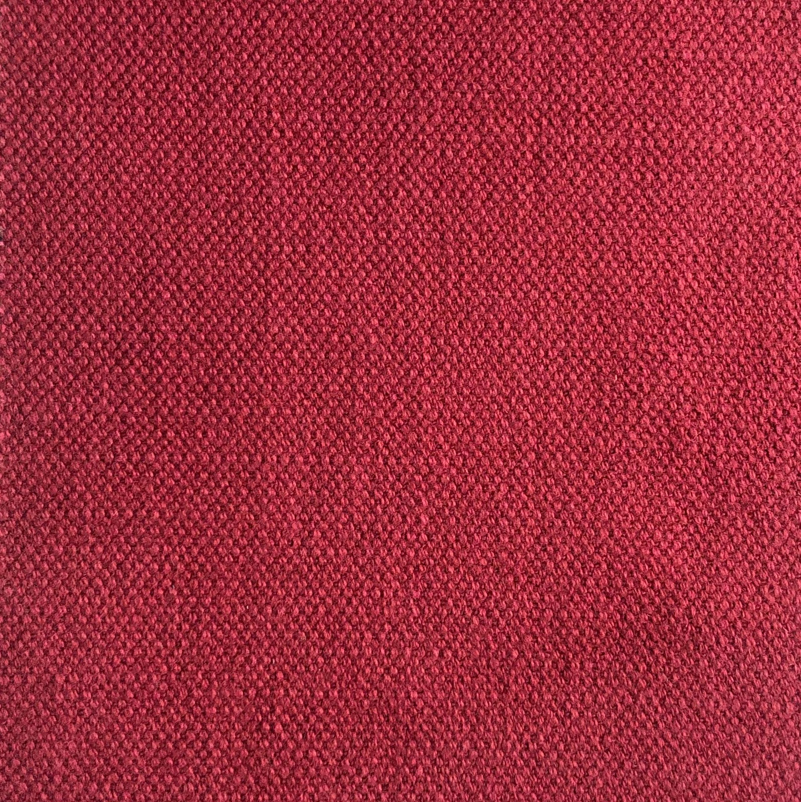 Deep raspberry-red close weave with subtle darker flecks across the swatch