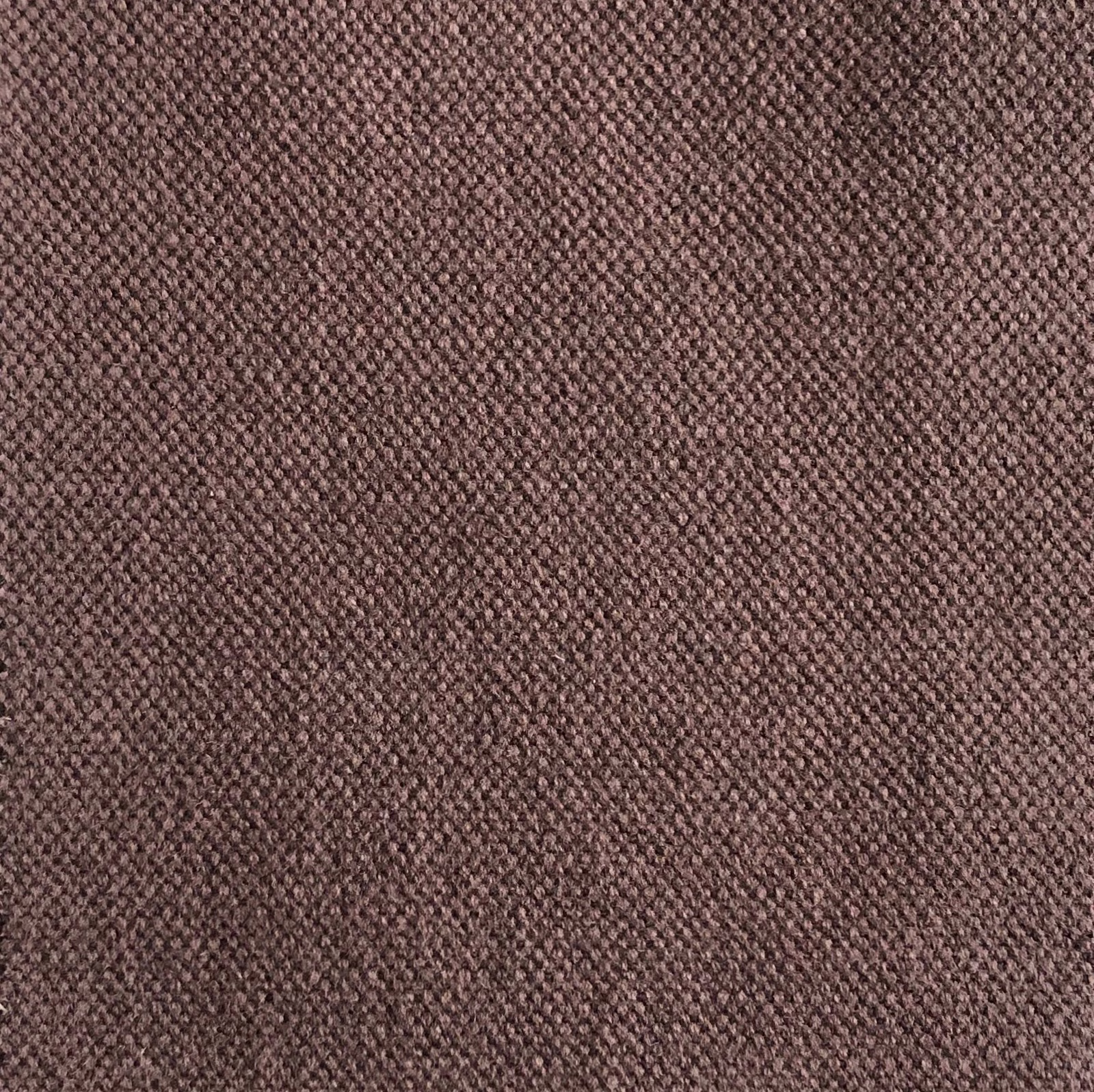 Close view of muted cocoa-brown fabric with a dense, softly flecked weave
