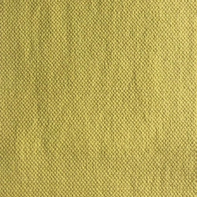 Close-up of Duo 205’s muted olive-yellow woven texture with fine pebbled detail