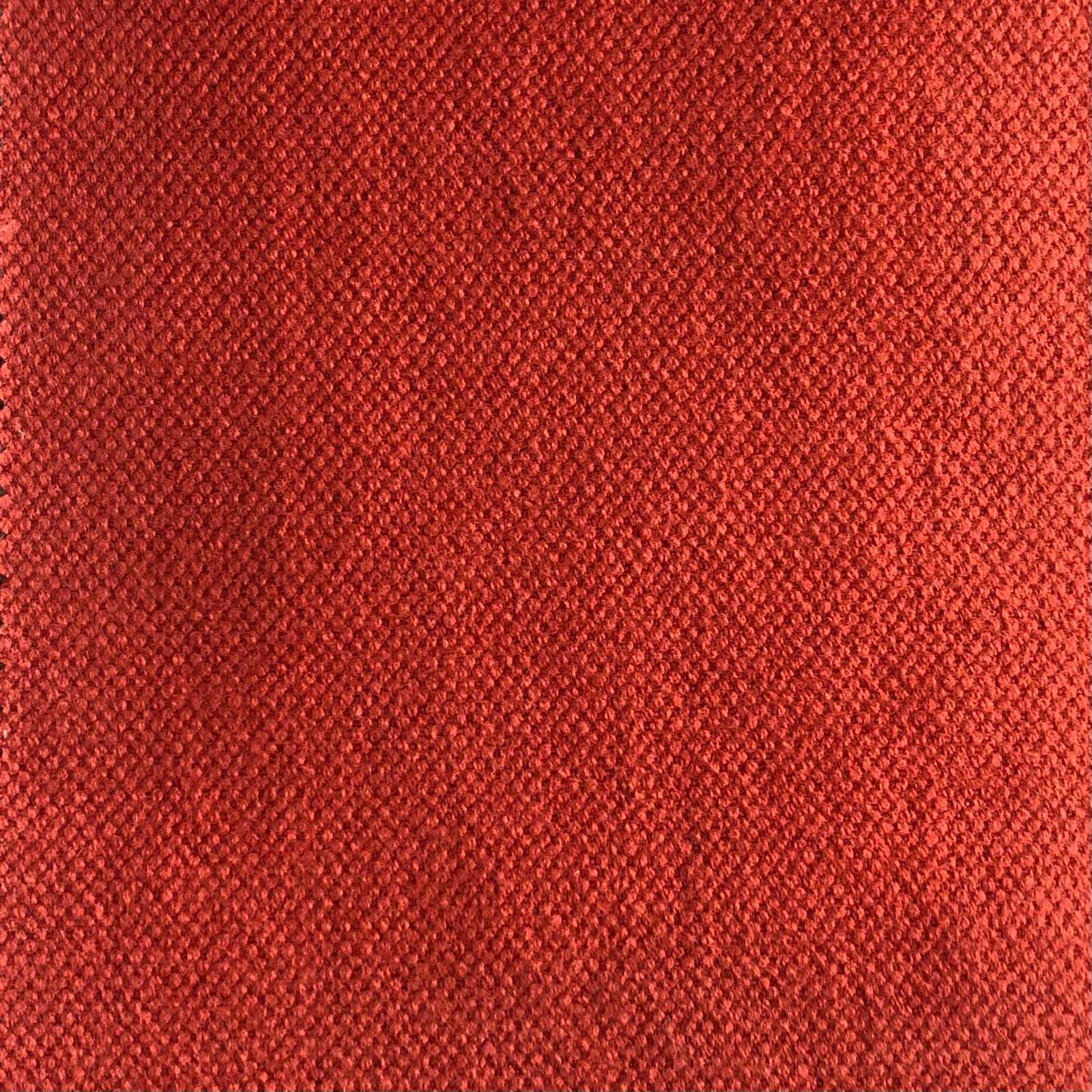 Close-up of warm vermilion Duo 208 with dense, finely pebbled woven texture
