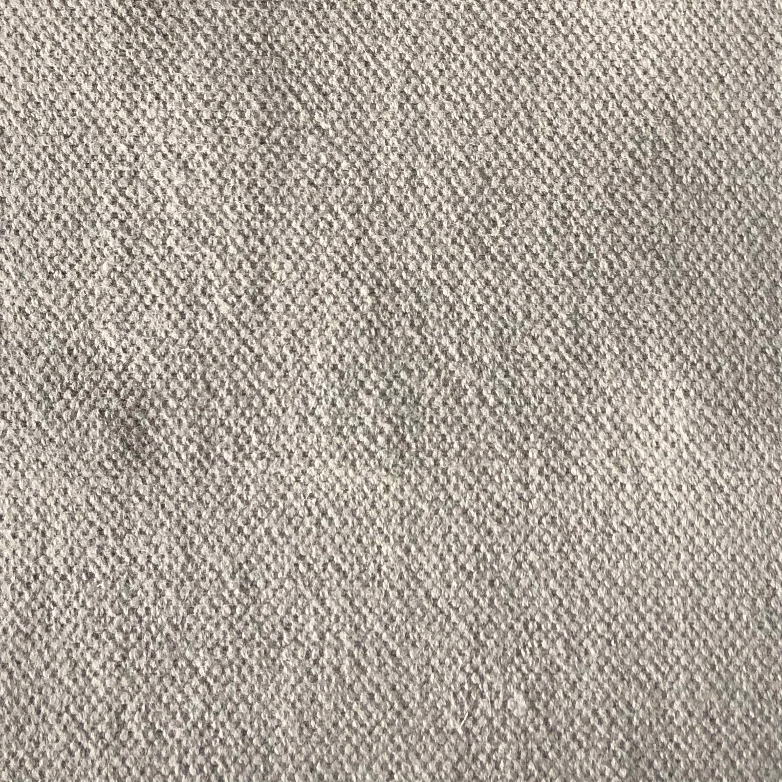 Close view of warm greige Duo 210 fabric with a small nubby woven texture