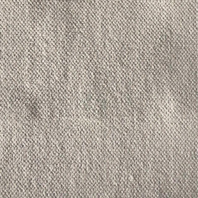 Close view of warm greige Duo 210 fabric with a small nubby woven texture
