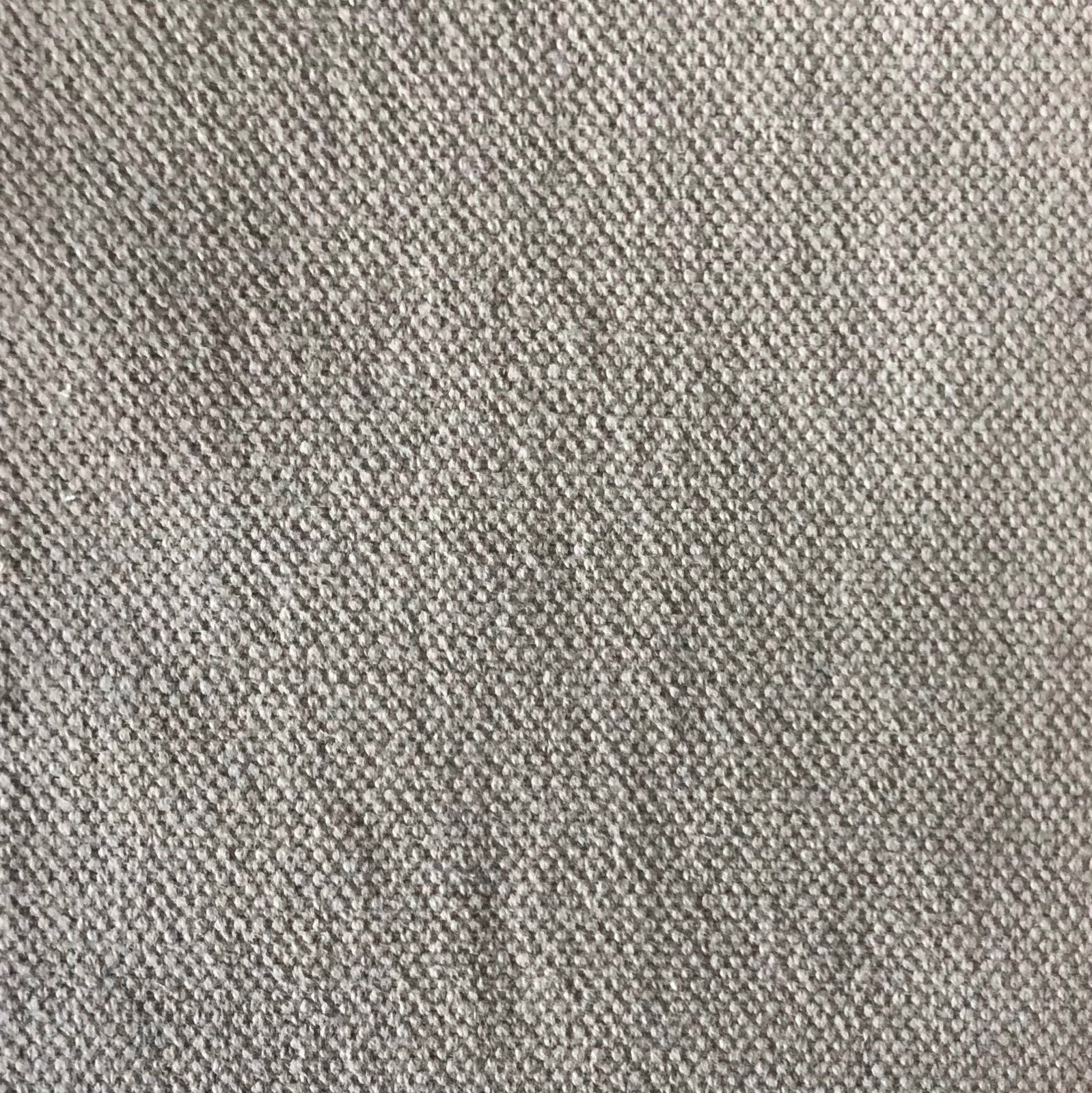 Warm greige micro-woven fabric with a softly pebbled, tonal grey surface