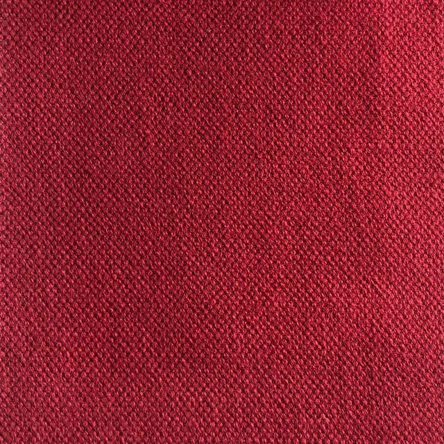 Deep crimson-red close weave with dark flecks and tactile diagonal texture