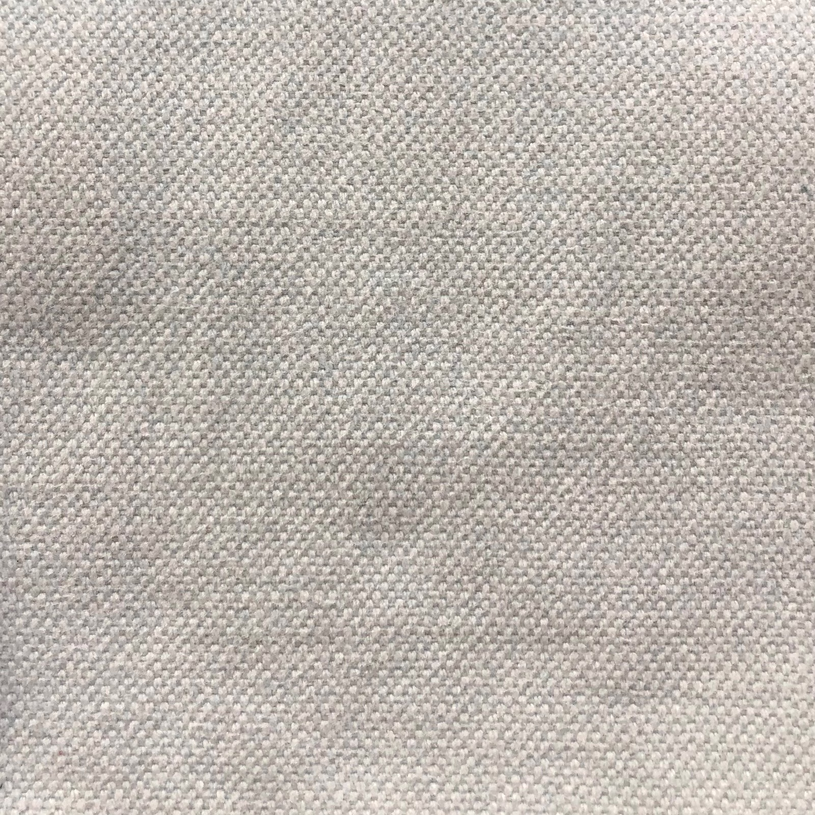 Pale greige woven textile with fine charcoal flecks and a softly tactile surface