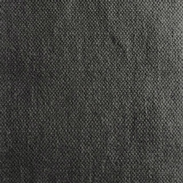 Close-textured charcoal grey weave with black flecks and subtle diagonal grain