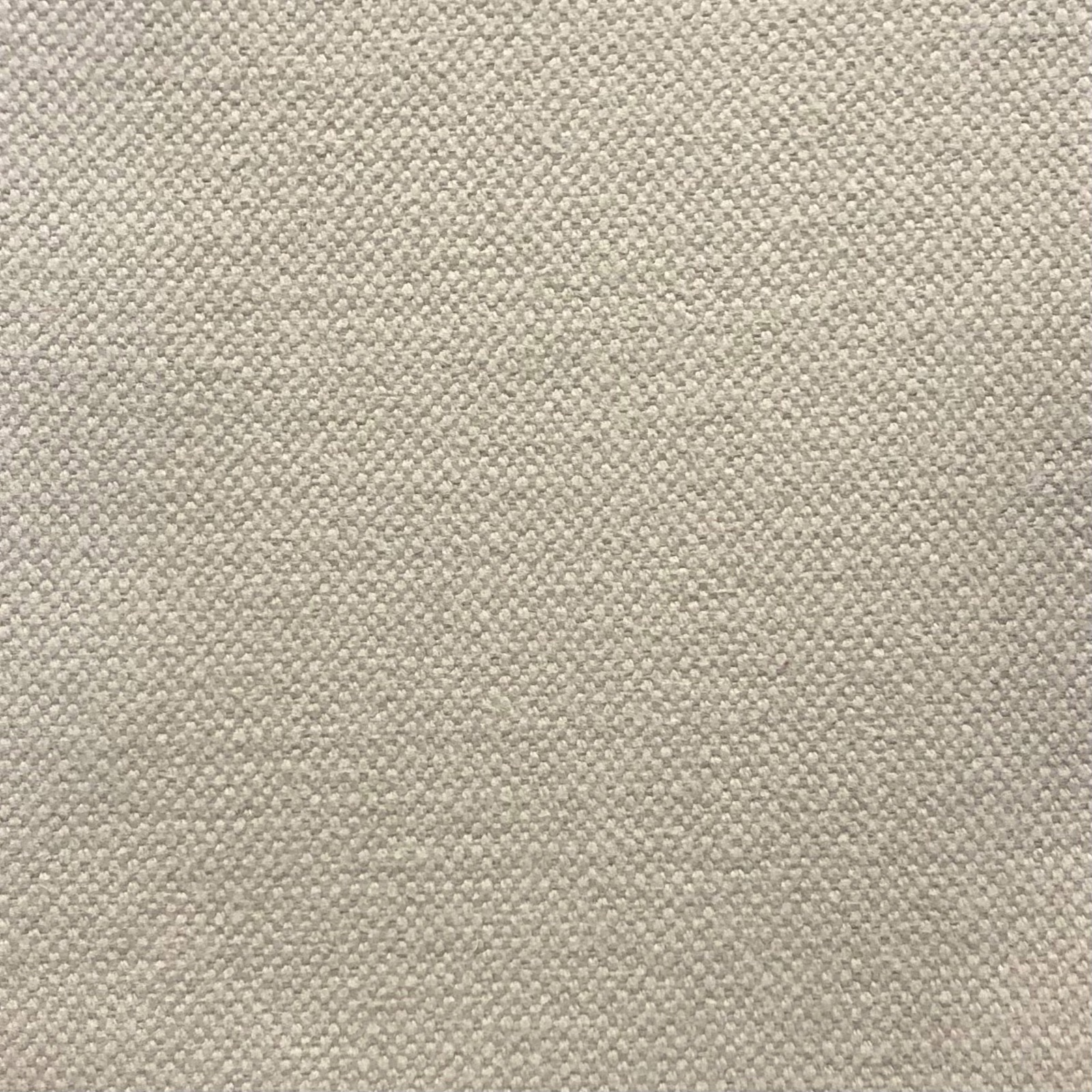 Close-up of warm stone greige fabric with a fine, subtly flecked woven texture