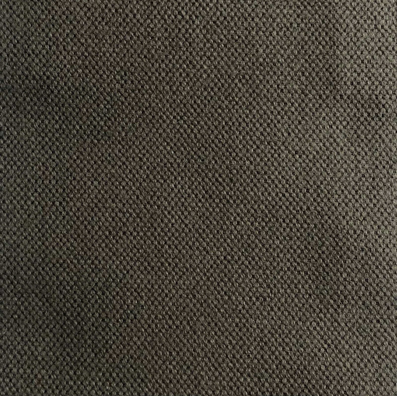 Close-up of charcoal olive-grey fabric with a dense, pebbled woven texture
