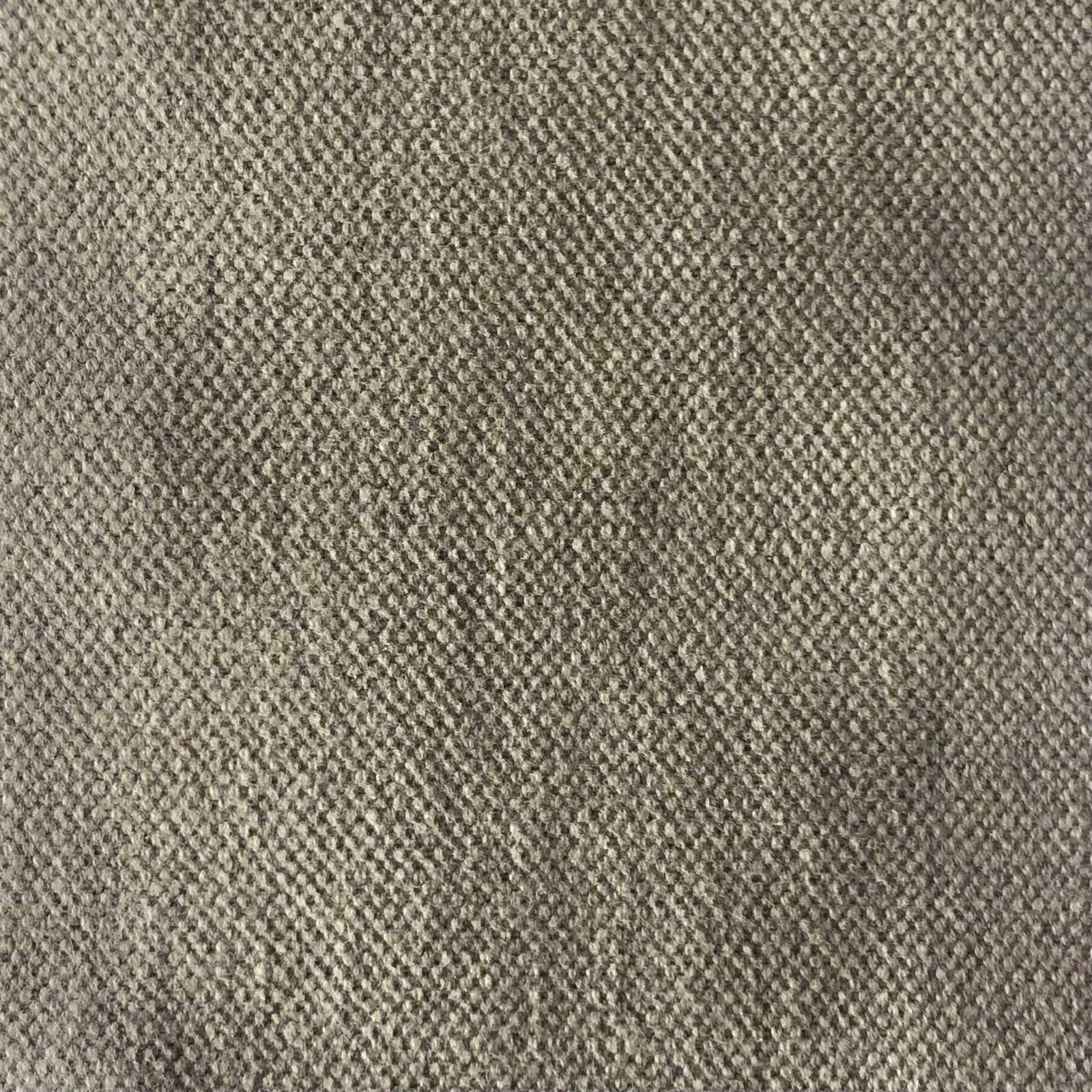 Close-up of muted taupe-grey fabric with dense, mottled woven texture
