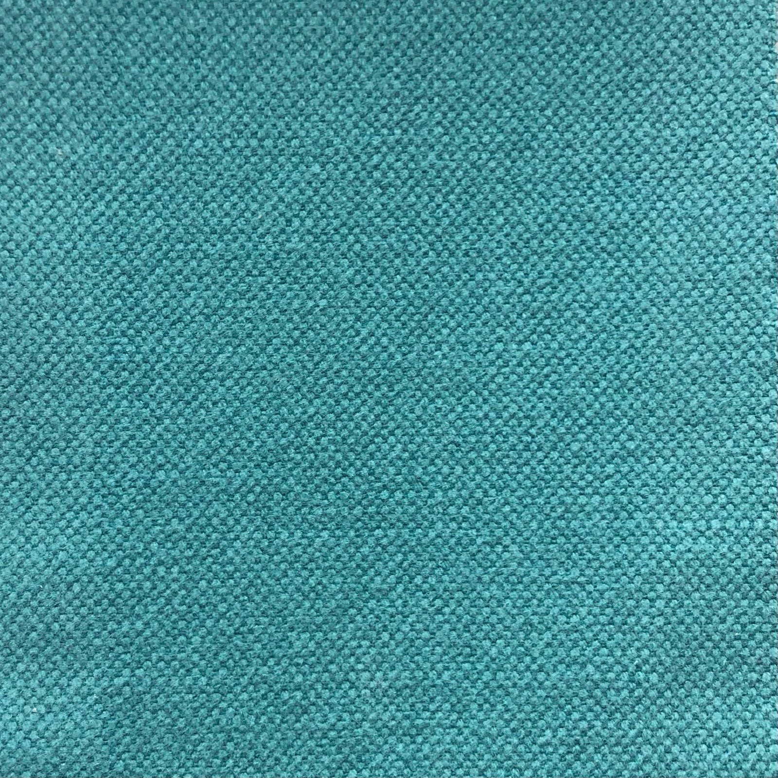 Close-up of Duo 274’s cool turquoise teal fabric with a fine pebbled weave