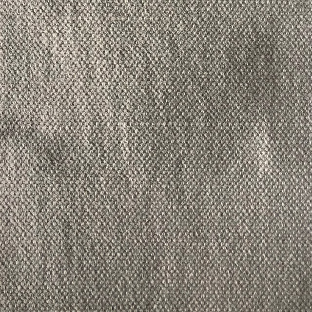 Mottled warm grey woven swatch with fine interlaced texture and soft tonal depth