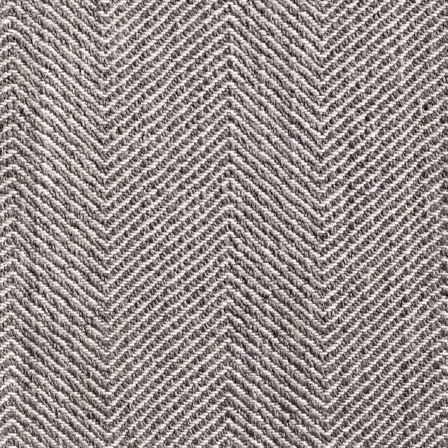 Close-up of Galdana Grey’s charcoal and ivory chevron weave with tactile texture