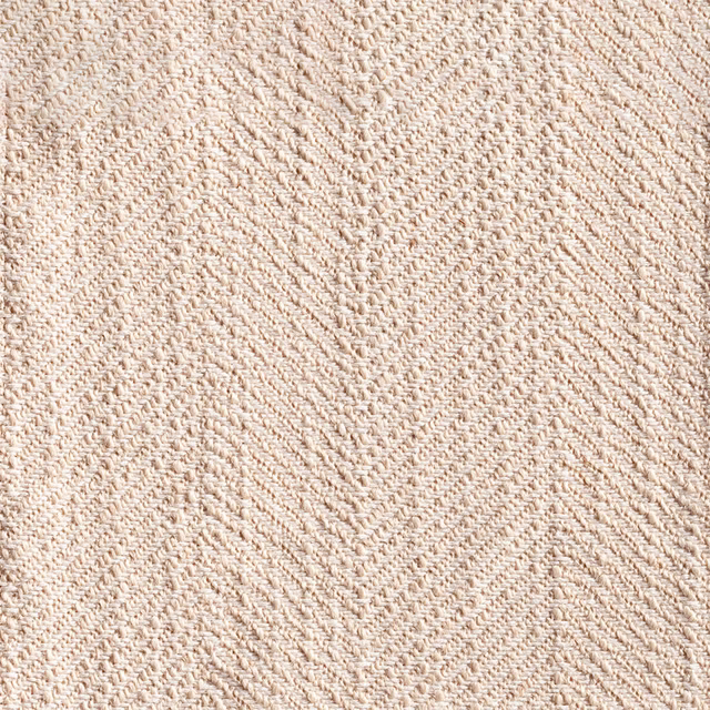 Warm ivory-beige woven fabric with tactile diagonal herringbone texture