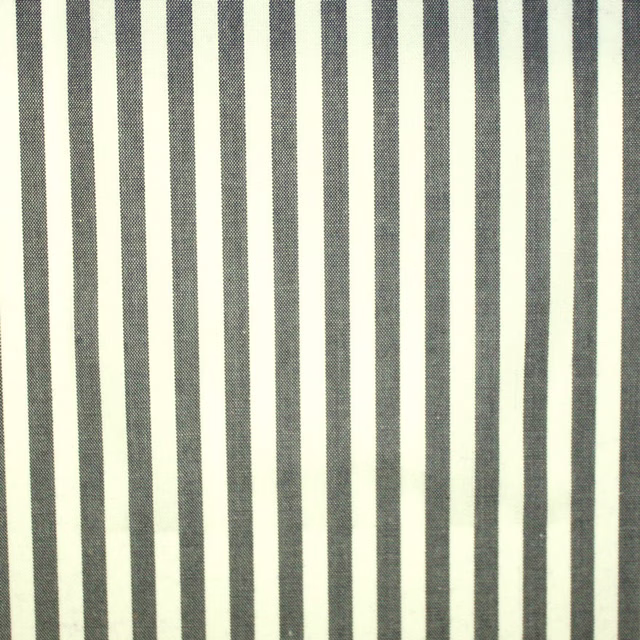 Close-up of fine woven fabric with charcoal and ivory vertical stripes
