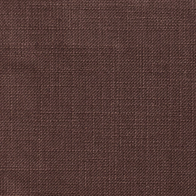 Close-up of warm cocoa-brown fabric with a fine, irregular woven texture
