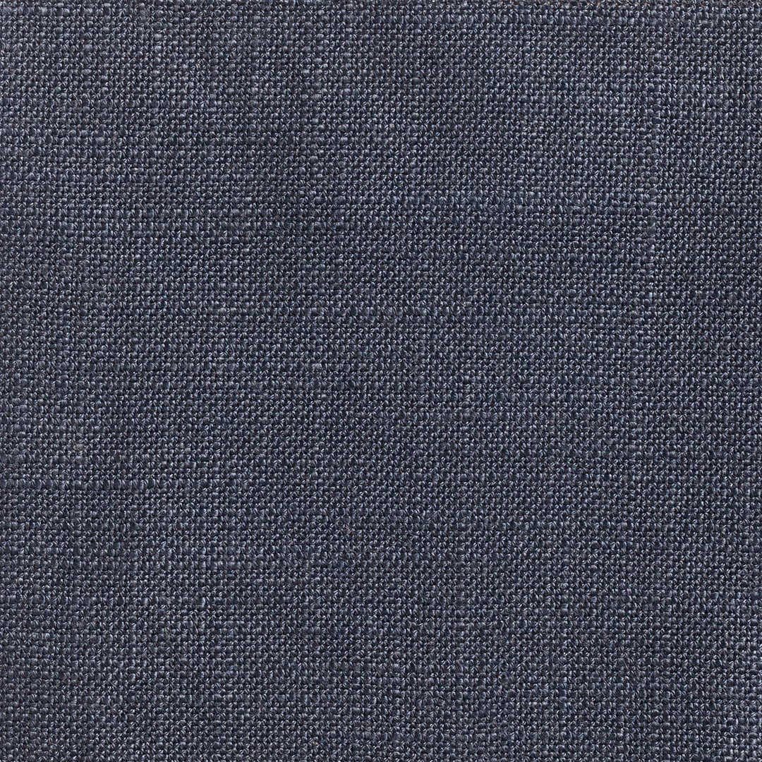 Close-up of dark navy Ikema fabric with a fine blue-grey woven texture
