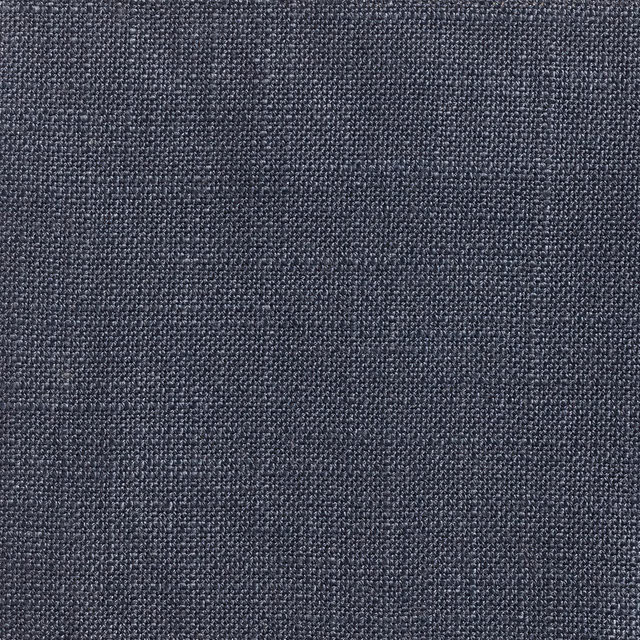 Close-up of dark navy Ikema fabric with a fine blue-grey woven texture