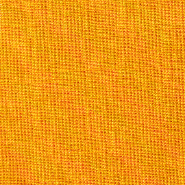 Close-up of vivid orange Ikema Soleil showing a fine, tactile plain weave