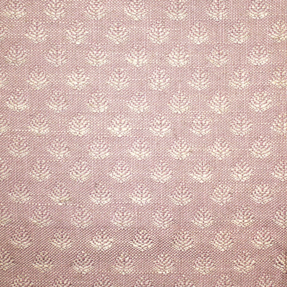 Dusty blush-pink woven fabric with repeating small ivory floral motifs