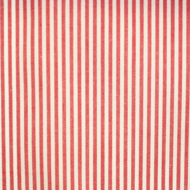 Warm coral-red and cream fine vertical stripe fabric with a subtle woven texture