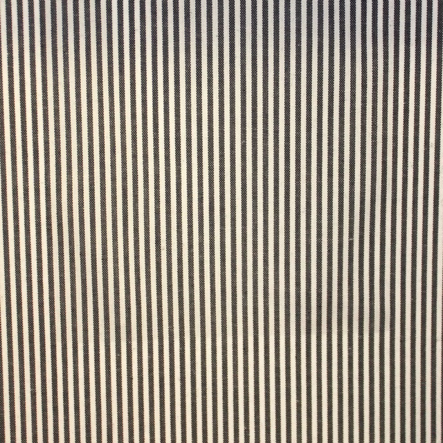 Charcoal and ivory narrow vertical stripe fabric with a lightly textured woven surface