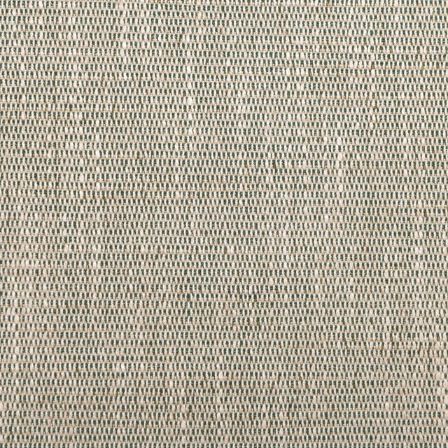 Close-up of muted avocado green fabric with a fine cream-speckled woven texture