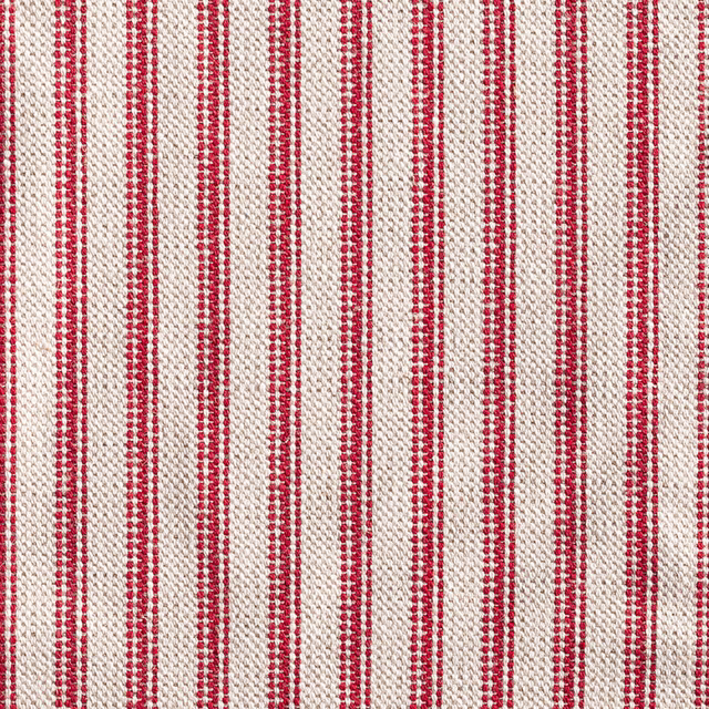 Warm red and ivory woven ticking with narrow vertical stripes and slubby texture