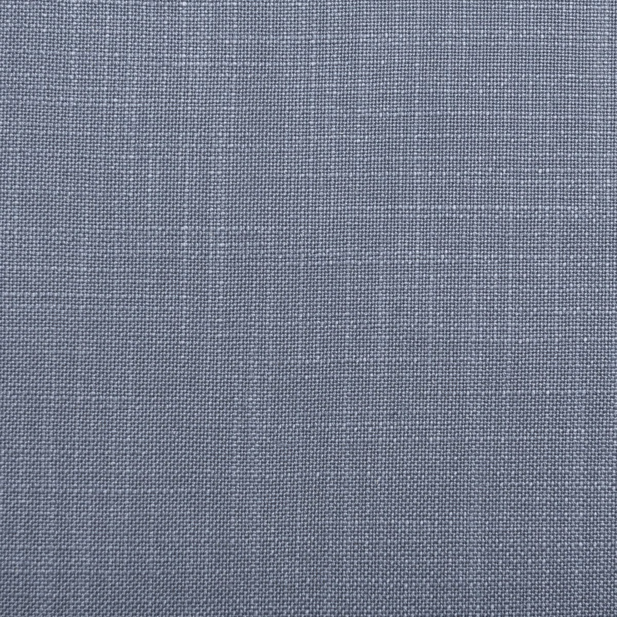 Close-up of muted cornflower blue-grey fabric with a fine crosshatched weave