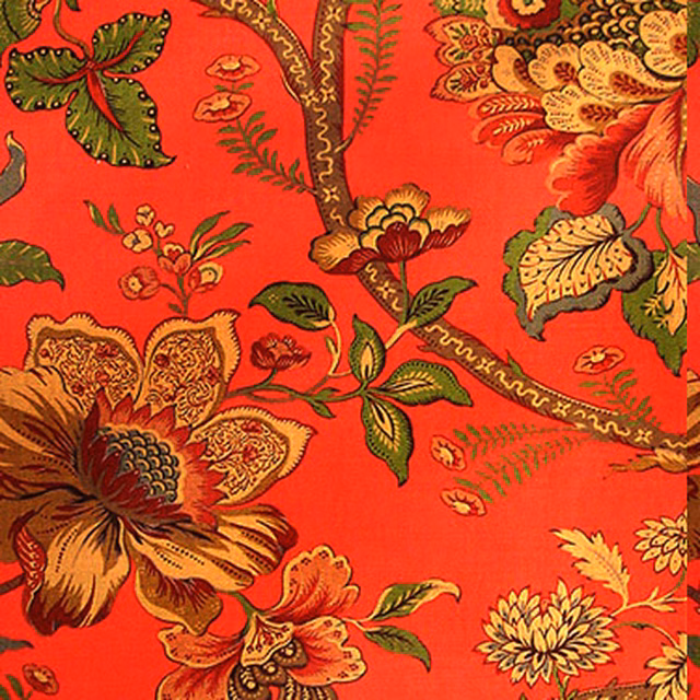Bright cinnabar-red floral fabric with large flowers and green leaves