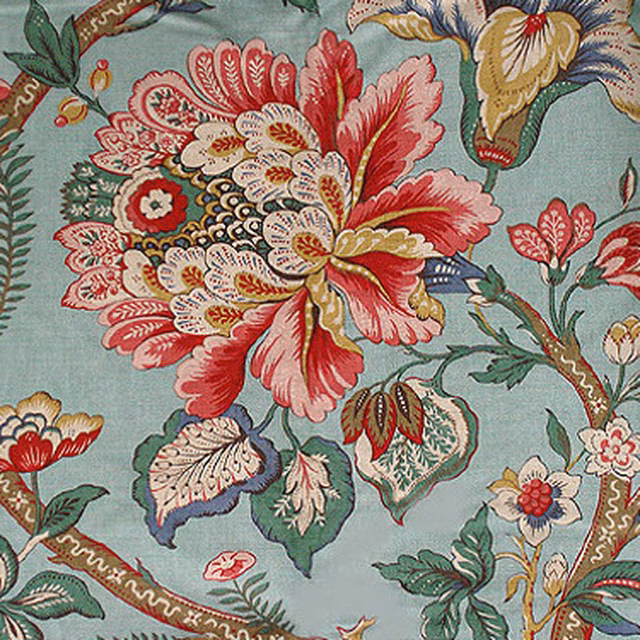 Large floral print on aqua green ground with pink, red and cream flowers