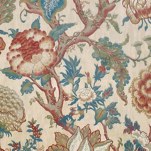 Large-scale floral print with sage leaves, berry blooms and teal accents on a cream ground
