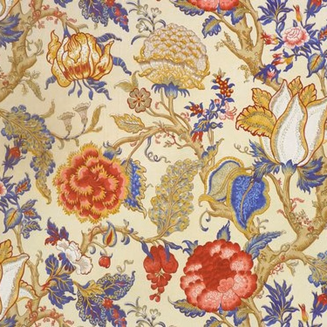 Large-scale floral fabric on a cream ground with ruby red and lapis blue blooms