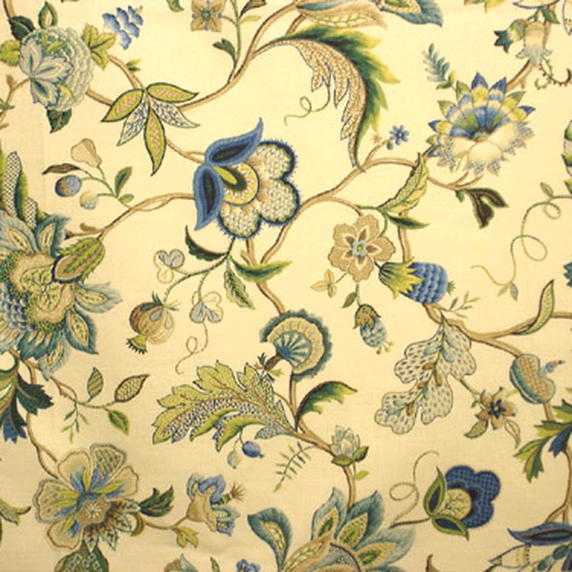 Painterly blue and green floral fabric on a soft cream ground