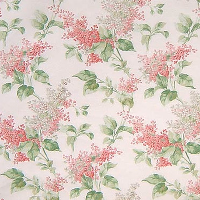 Pink lilac floral print with soft green leaves on a pale ground