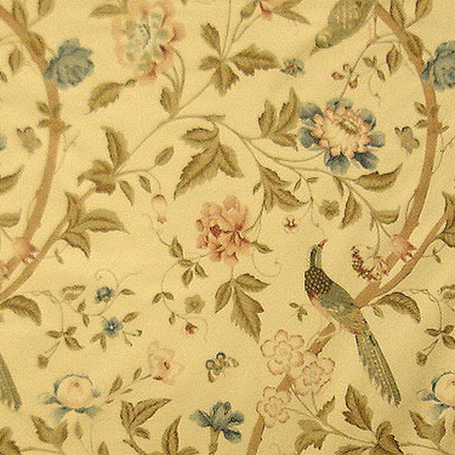 Warm beige patterned fabric with brown branches, floral sprays and birds