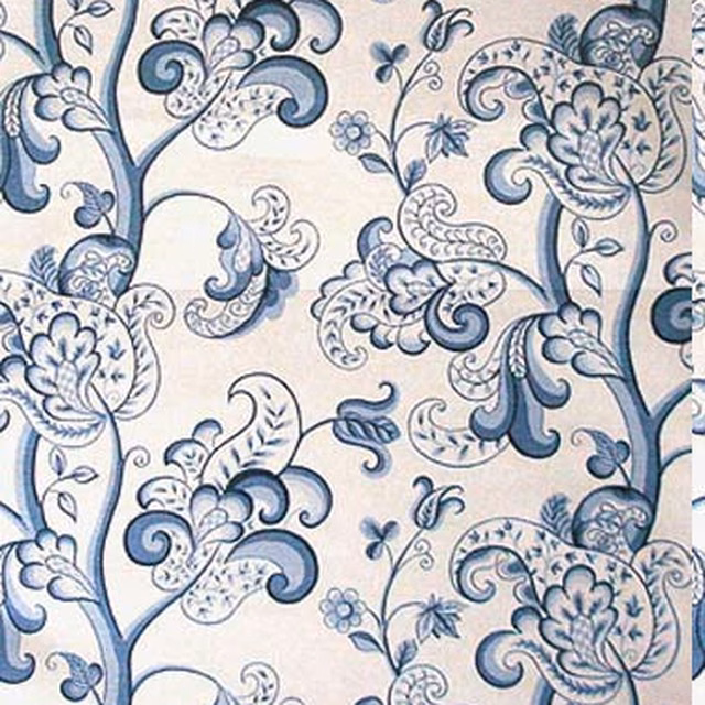 Blue and cream large-scale floral scroll fabric with stylised leaves and vines