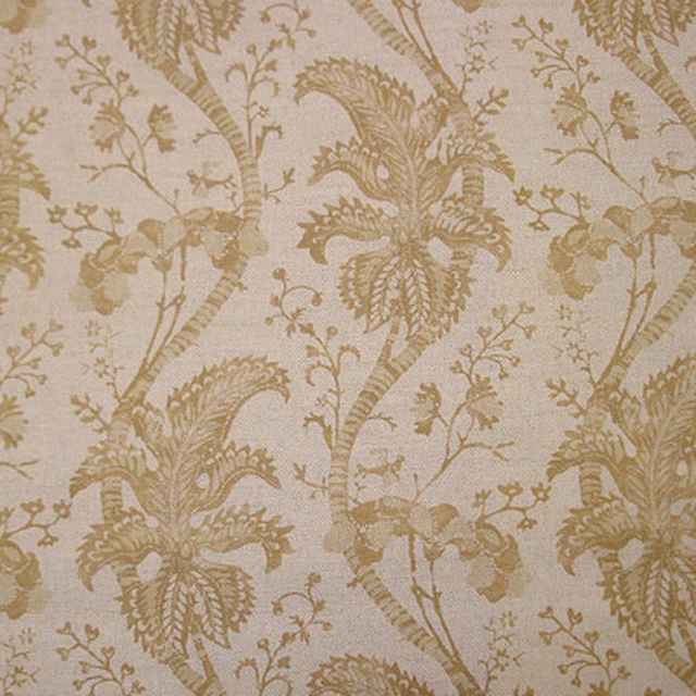 Soft beige gold botanical fabric with trailing leaf motifs and textured weave