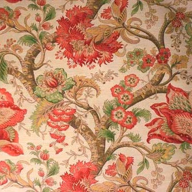 Large floral tree-of-life pattern in red, pink, green and brown on beige ground