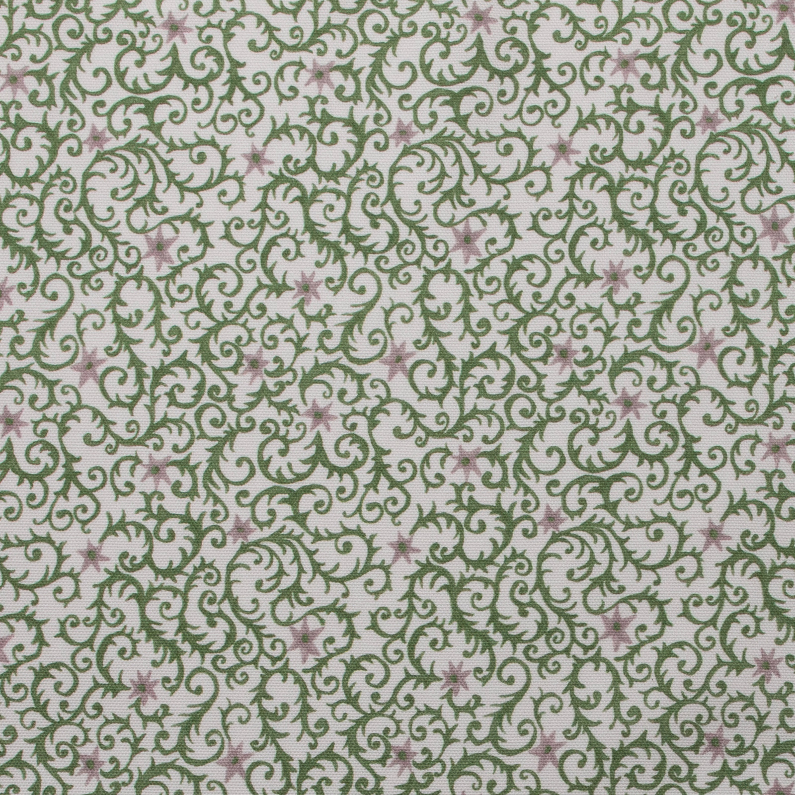 Olive green scrolling filigree print with small mauve star motifs on pale cotton
