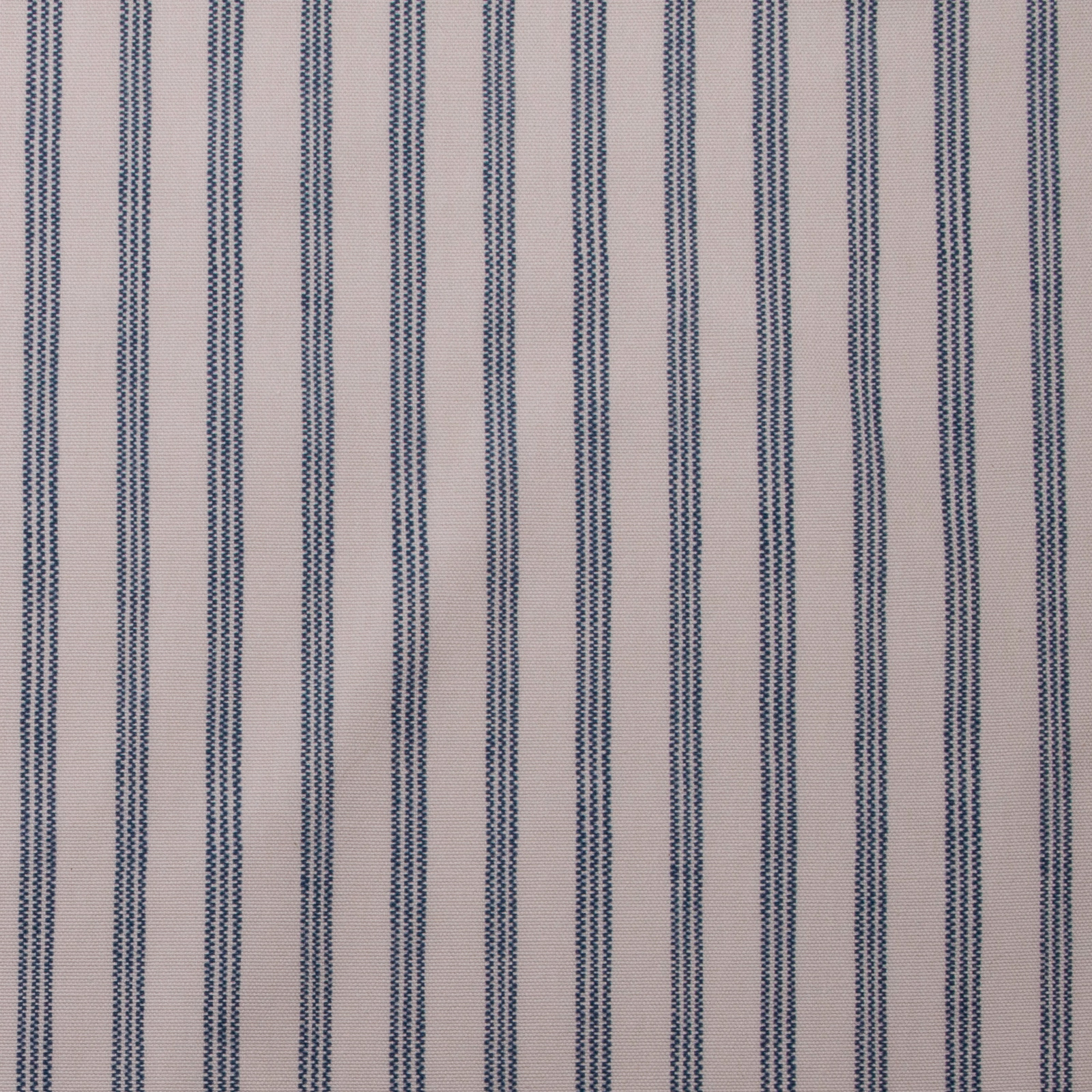 Pale cotton fabric with narrow denim-blue vertical pinstripes on a light ground
