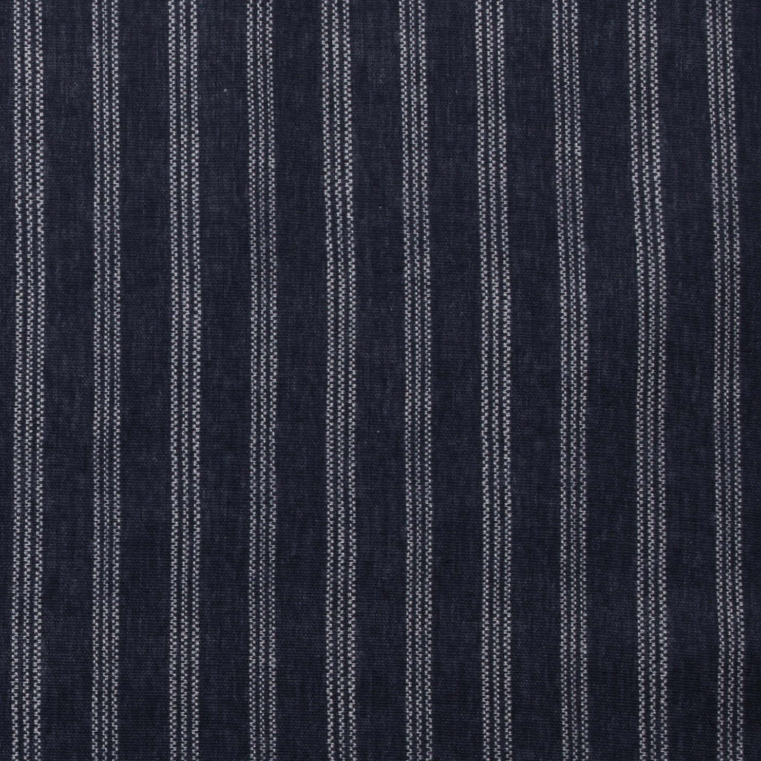 Dark indigo cotton fabric with narrow vertical pale pinstripes