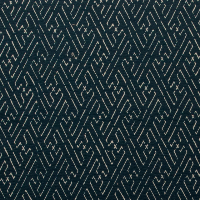 Deep blue-green printed cotton with a crisp ivory geometric trellis pattern