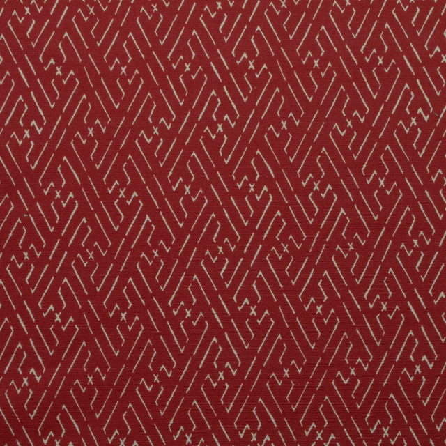 Red geometric trellis print with pale zigzag lines on cotton